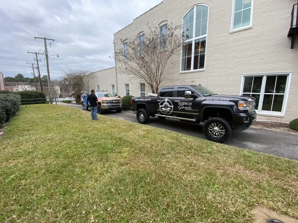 Exterior Genie crew and trucks on site at a commercial property