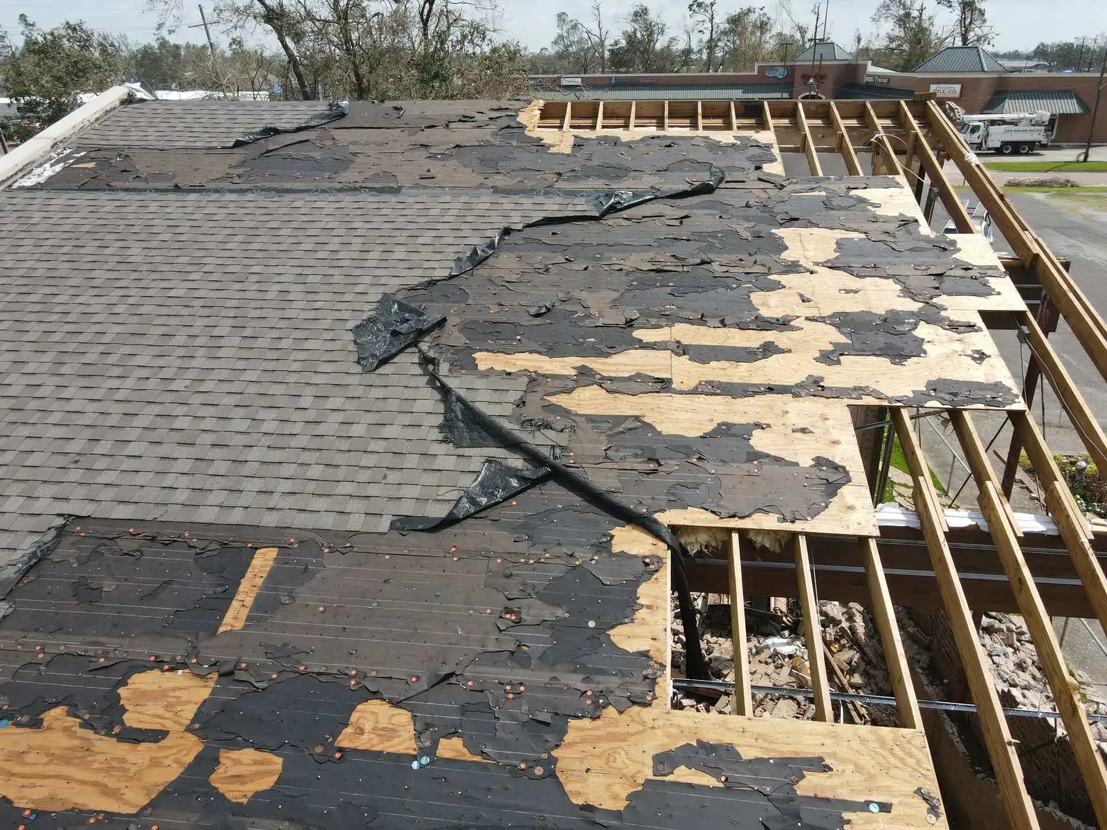 Storm damaged commercial roof documented during an insurance inspection
