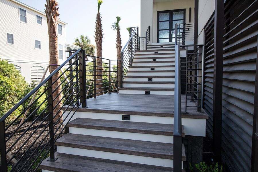 Custom composite deck and staircase with modern metal railings